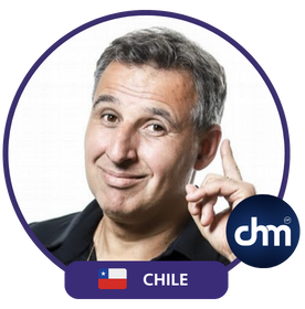 Marcelo Borlando, a marketing expert from Chile, smiling and gesturing with one finger raised, with the Chilean flag and 'dhm' logo in the image.