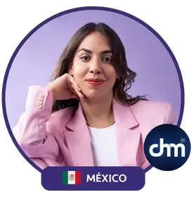 Alejandra Tejeda, a Mexican speaker and coach, representing Mexico, wearing a pink jacket with a purple background.